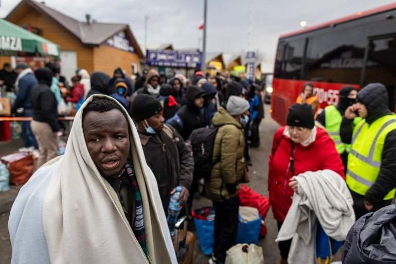 Refugees from many countries including in Africa, the Middle East and India - mostly students of Ukrainian universities - are seen at the Medyka pedestrian border crossing in eastern Poland 